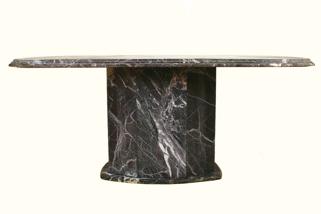 From the Art Deco period and of three-piece construction, having an 8 sided Baroque influenced alternating concave and convex moulded edge top above a central pedestal of the same form, resting atop a flat moulded edge platform, the marble most