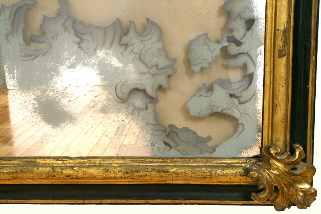 Italian Baroque Carved Giltwood and Ebonized Mirror