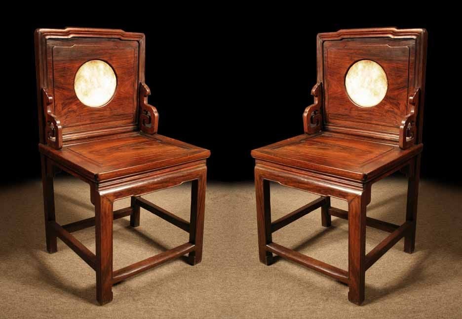 PAIR Chinese hongmu (a hardwood similar to Padouk) meditation chairs having paneled backs centering marble 'dream stone' inserts. <br />
The square seat over a beaded apron and straight legs, joined by stretchers. <br />
Chinese, 19th Century<br