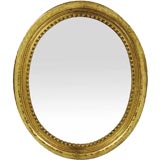 Antique Victorian Giltwood Oval Mirror .