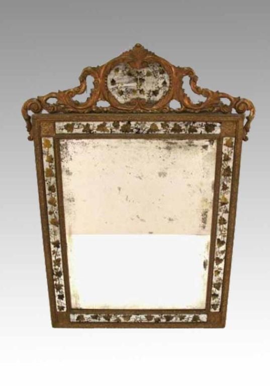 Neoclassical style silver and gold eglomise decorated Mirror stamped on the reverse 