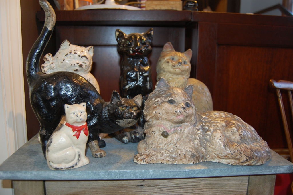Set of six cast iron cats early 20th century a charming collection.