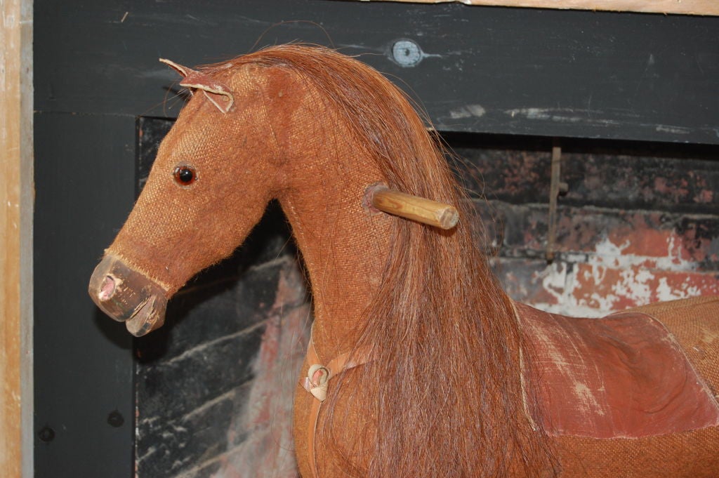 This is a really sweet childs toy horse in great shape.<br />
Perfect for over the mantle.