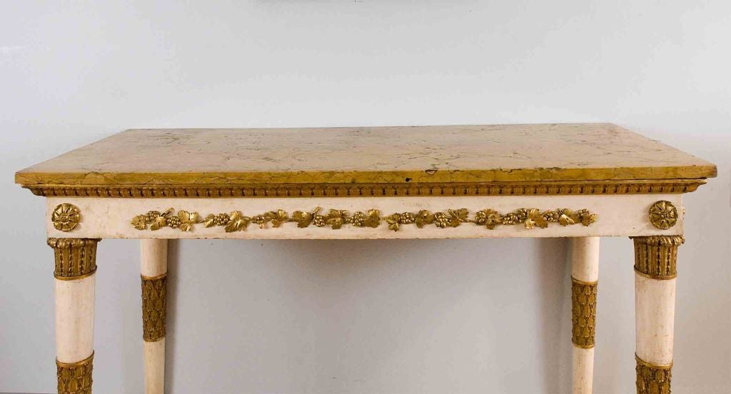 A Florentine Creme Painted and Parcel Gilt Console Table