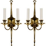 Antique A pair of tall two arm brass wall sconces