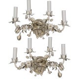 A pair of four light tole sconces A pair of four light tole sconces