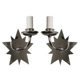 A pair of single arm star sconces by Cassidy & Co.
