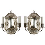 Antique A pair of silverplated two arm sconces