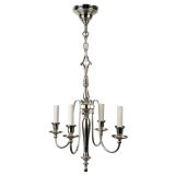 A baluster-form four arm chandelier