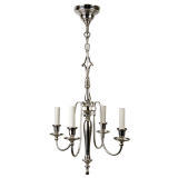 Antique A baluster-form four arm chandelier