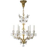 A five-light gilded brass and crystal chandelier