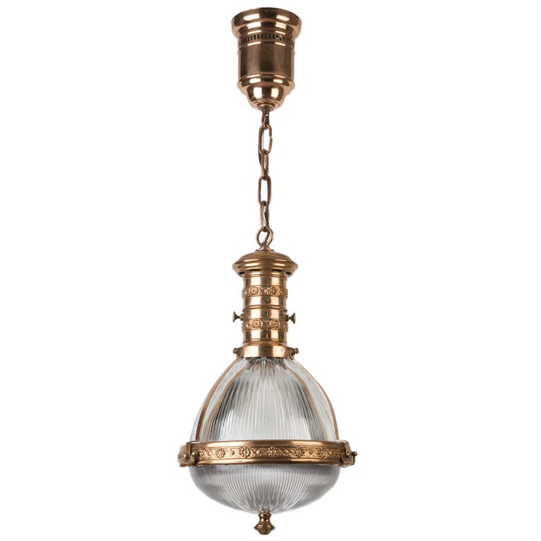 A prismatic glass pendant with copper fittings