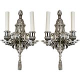 A pair of two arm sconces by the maker E. F. Caldwell