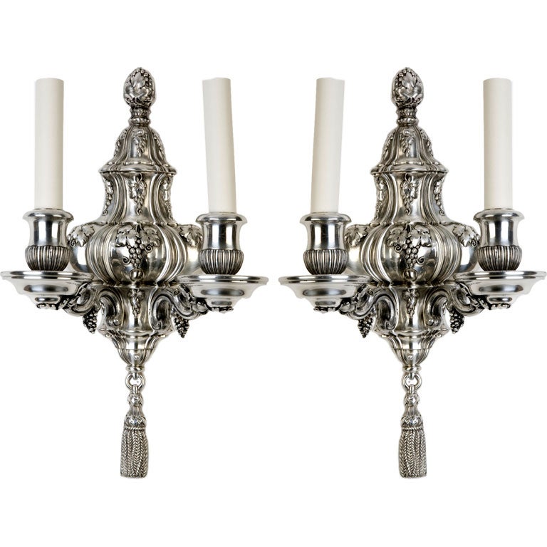 A pair of two arm sconces by the maker E. F. Caldwell