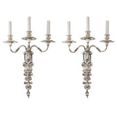 A pair of three-arm silver plated sconces