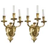 A pair of three arm gilded bronze sconces