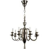 An eight arm nickel chandelier by Bradley and Hubbard