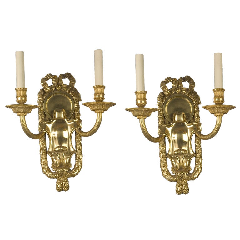 Coppia di sconsigli a due bracci in bronzo dorato e rame di E. F. A. Co. del 1910