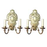 A pair of two-arm sconces by the Sterling Bronze Co.