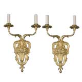 A pair of gilded two-arm sconces by E. F. Caldwell Co.