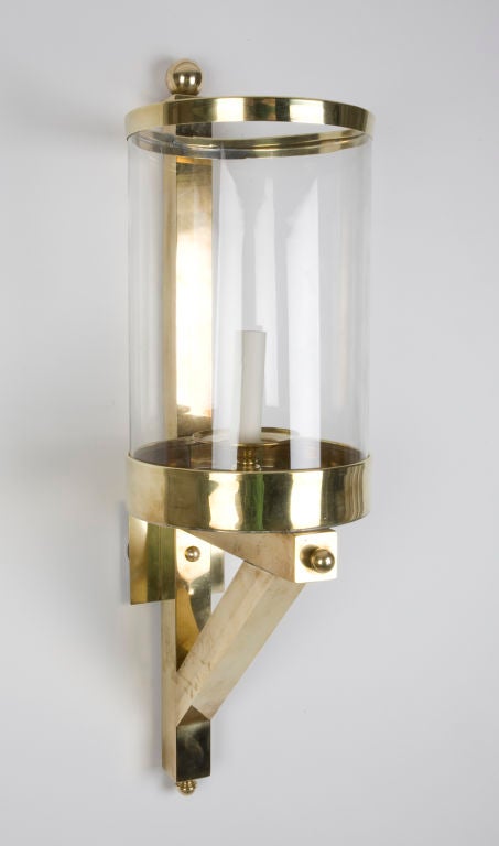 A large pair of cylindrical brass wall lanterns