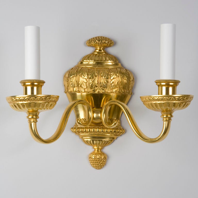 A gilded two arm sconce by the maker E. F. Caldwell
