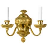 A gilded two arm sconce by the maker E. F. Caldwell