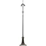 An ornately detailed floor lamp by Bradley & Hubbard