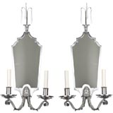 A pair of two arm mirrored sconces