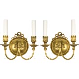 A pair of two arm gilt brass sconces by the maker E.
