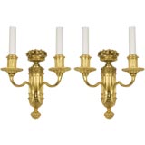 A pair of two arm gilt sconces by the E. F. Caldwell