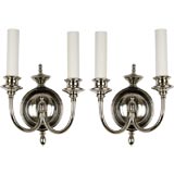 A pair of two arm sconces by  Bradley & Hubbard