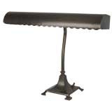 A brass scalloped-edge table lamp
