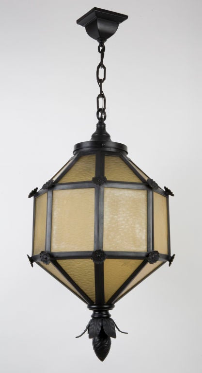 A black enamel and amber glass lantern
