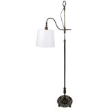 Antique An adjustable height, bridge-arm floor lamp