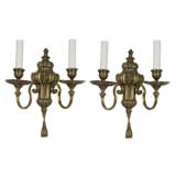 A pair of two arm brass sconces