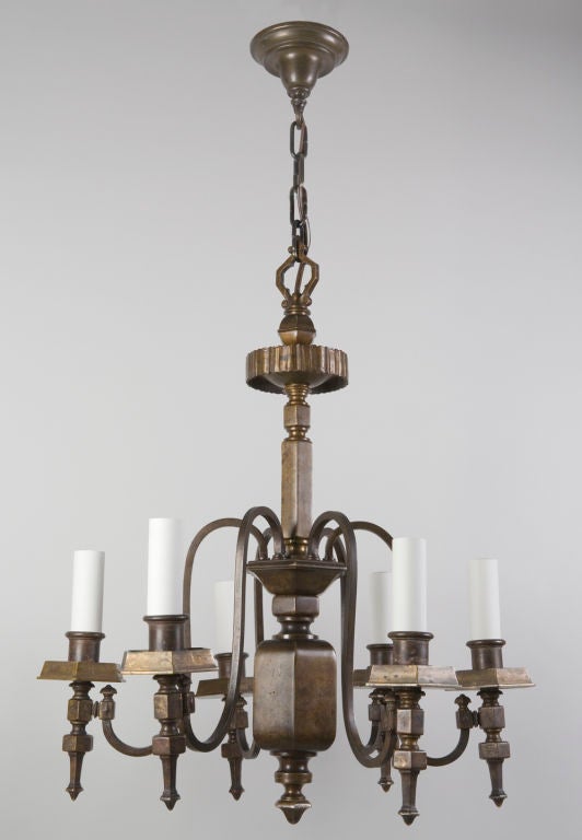 A dark bronze six-light chandelier