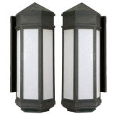 A pair of patinated brass wall lanterns