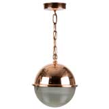 A copper and holophane glass globe pendant