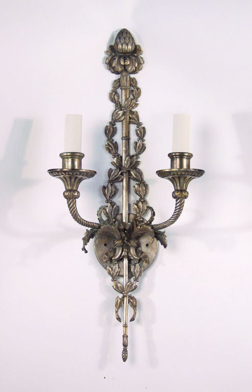 A pair of two light wall sconces