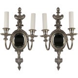 Antique A pair of mirrorback silverplated sconces