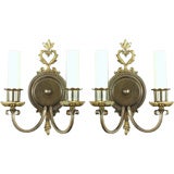 Antique A pair of dark brass double light sconces