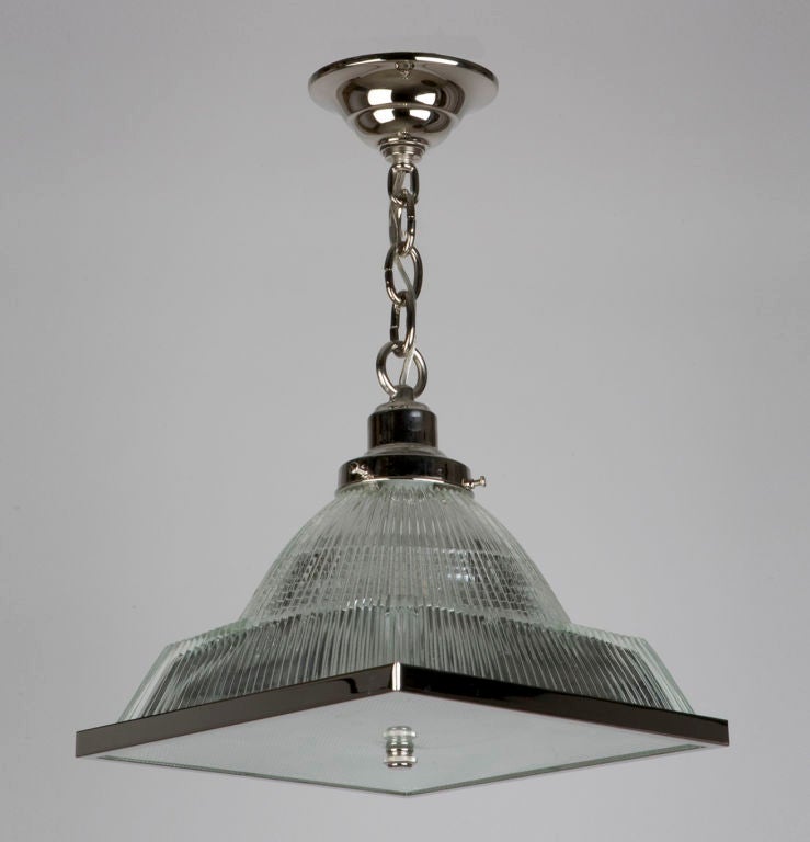 A pyramidal holophane glass pendant