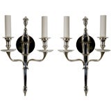 A pair of silverplated two arm sconces