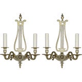 A pair of silver lyre-back sconces