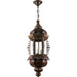 A hand hammered six-sided copper lantern