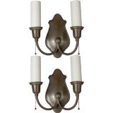 A pair of shield-back sconces by Bradley & Hubbard