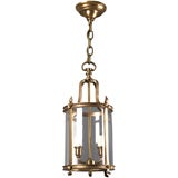 A cylindrical hall lantern by Horn and Brannon
