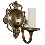 Antique A single dark brass patinated sconce