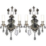 A pair of two arm mirrorback and crystal sconces